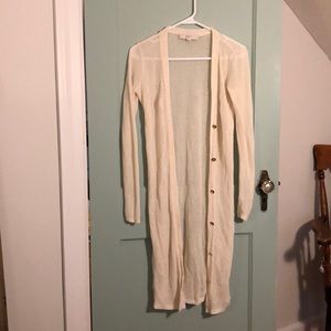 Cream duster with gold buttons